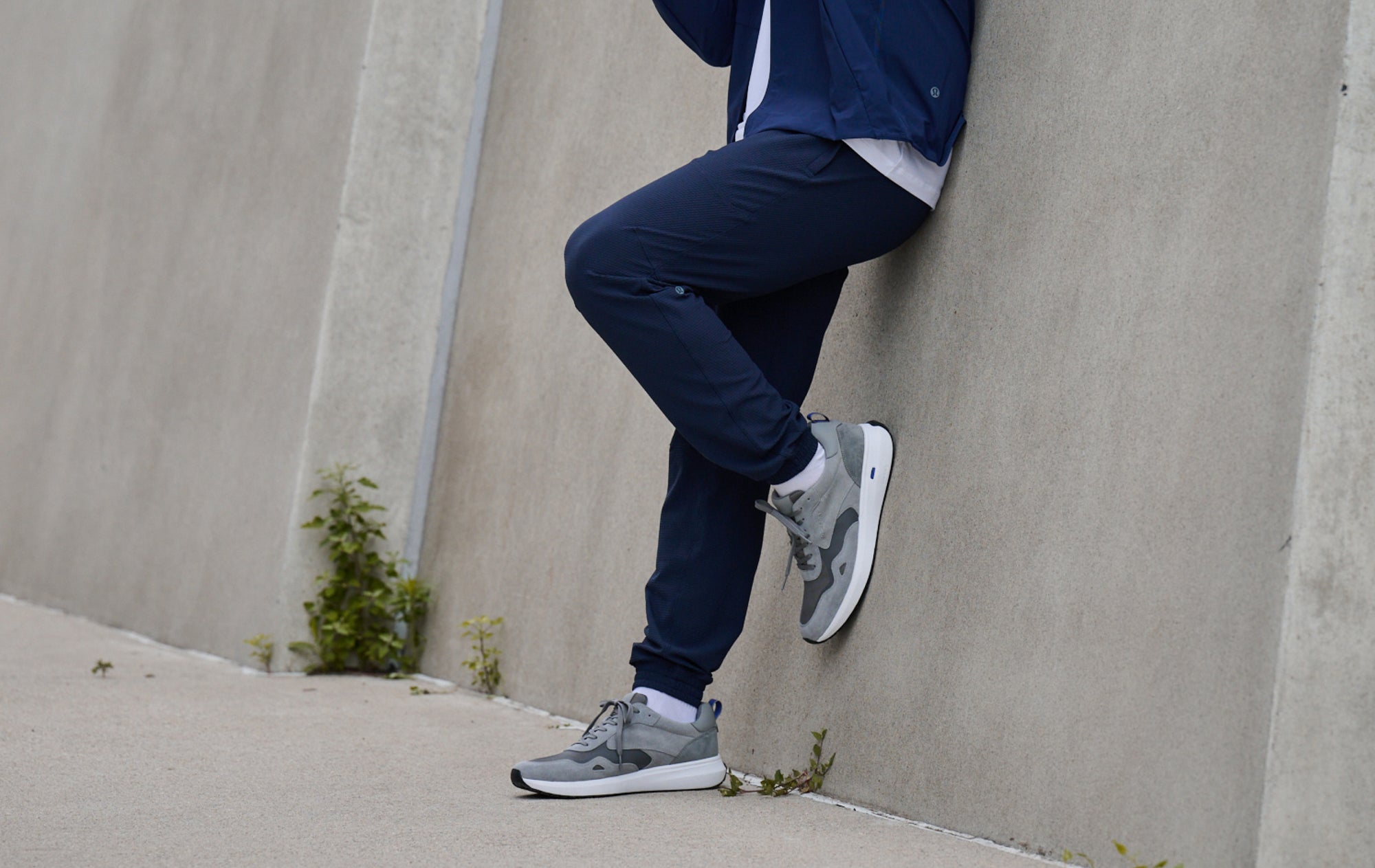 Editorial banner featuring model wearing Tilman sneakers